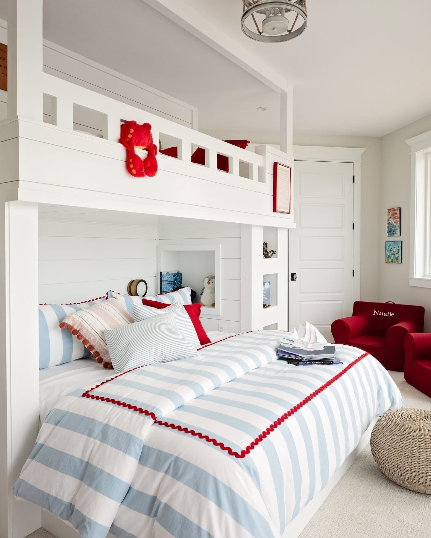 Coastal bedroom design with soft bedding and playful accents